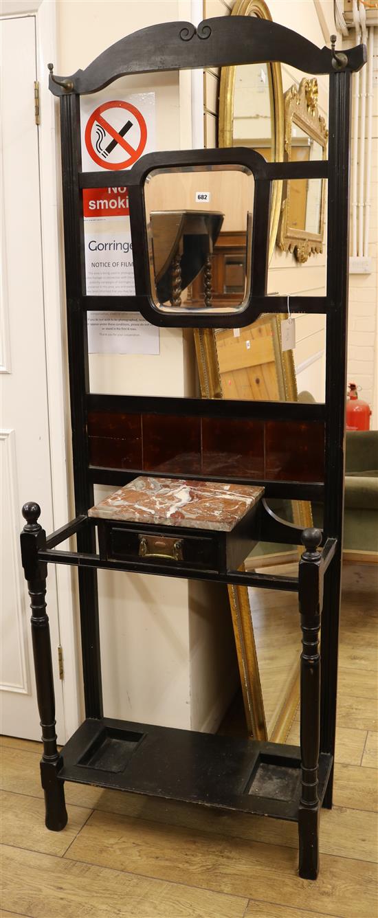 An Edwardian ebonised hall stand